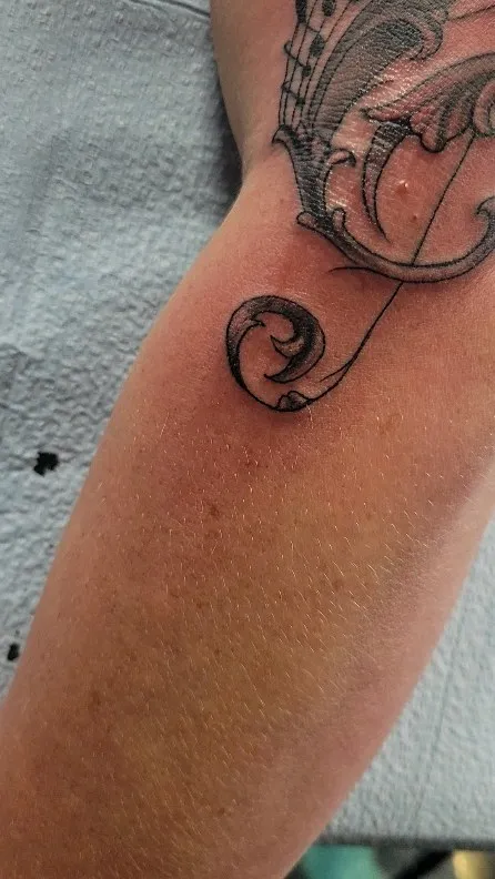 Tattoo by Pete Delia at Fallen Raven Tattoo Studio